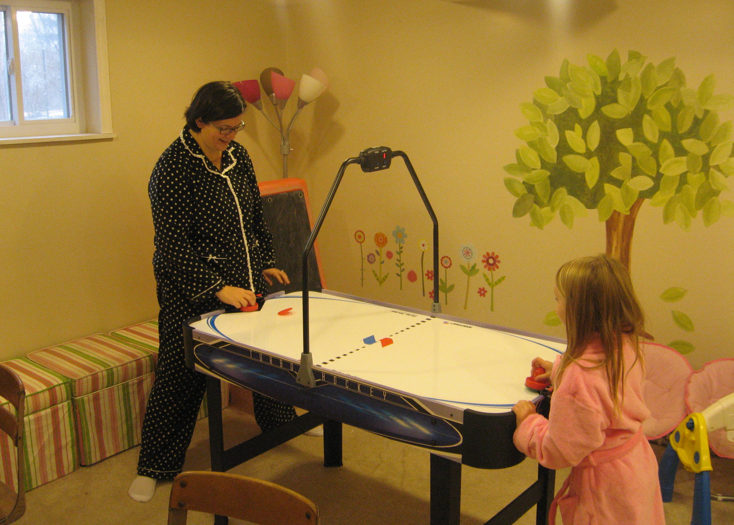 2009_12_25 Mom and Cate playing air hockey.jpg